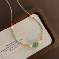 Beaded necklace with green faceted stones, fresh water pearls and marble pattern charm - Pale Green Zirconia Freshwater Pearl Style (06-J-3)