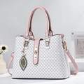 White monogram tote bag with pink leather trim, gold lock, and pearl leaf charm - White & Pink