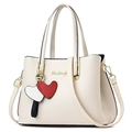 Beige faux leather handbag with lychee pattern, golden logo, and heart-shaped charms - Off-white