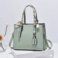 Fashionable light green handbag with silk scarf handle and golden hardware detail - Green
