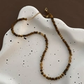 Handmade tiger eye beaded necklace with gold metal rings on artistic ceramic tray - Titanium Steel Tiger Eye Style (07-M7)