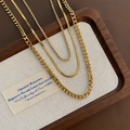 Ensemble de trois colliers dorés en acier inoxydable avec mailles cubaine et serpent - Collier à trois couches en acier inoxydable / Doré