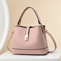 Elegant pink pebbled leather bucket bag with top handle and gold turn-lock closure - Pink
