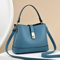 Blue pebble leather bucket bag with gold hardware and adjustable crossbody strap - Blue