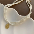 French retro style triple layer pearl necklace with a hammered gold oval pendant - Titanium Steel 3-Layer Pearl Necklace (02-N17)
