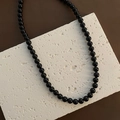 Polished black beaded necklace made of titanium steel with a sleek round pendant - M / Black