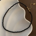 Minimalist black beaded choker necklace with a gold-plated lobster clasp and extension chain - S / Black