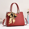 Red crocodile embossed tote bag with elegant scarf detail and detachable shoulder strap - Red