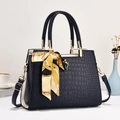Navy blue crocodile pattern handbag with gold hardware and stylish patterned silk scarf - Blue