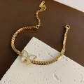 Gouden Cubaanse schakelarmband met witte schelpvlinder hanger op stenen basis - Titanium Stalen Vlinder Armband