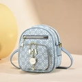 Light blue mini backpack with geometric print and a white cat charm detail - Blue