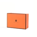 Close-up of orange gift box with heart icon and The best is for you text detail - Single Orange Gift Box