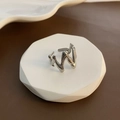 Modern M-shaped irregular wave open ring in polished silver finish on white stone stand - Silver