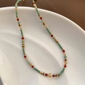 Ethnic style necklace with turquoise and red beads on a white ceramic display - Multi-color Natural Stone Necklace (06-M17)