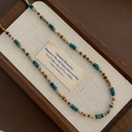Bohemian multicolored natural stone beaded necklace with gold accents on a display tray - Contrast Color Natural Stone Necklace (06-J21)