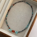 Handmade beaded necklace with turquoise stones, red agate center, and faceted dark beads - Vintage Agate Style (xk-88)