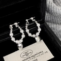 Elegant silver pearl hoop earrings with hammered heart charm in luxury jewelry box - Silver Heart Pearl Earrings