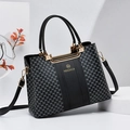 Chic black tote bag with DH pattern, dual handles, and gold hardware for women - Black
