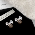 Detail of silver bow earrings with clear zircons and brown round tiger eye bead charm - Silver Bowknot Tiger Eye Stud Earrings