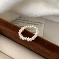 Minimalist French style freshwater pearl ring with a silver bead on velvet background - Freshwater Pearl Ring