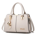 Chic beige crossbody handbag for women featuring litchi grain texture and pearl pendant - Off White