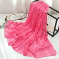 Detailed texture of rose pink chiffon scarf draped over a modern geometric metal stand - Rose Red