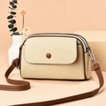 Beige litchi grain mini crossbody bag with dark brown trim and dual zipper compartments - Beige