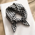 Elegant houndstooth pattern satin silk scarf displayed on a minimalist beige background - Black & White Houndstooth (FX-290)