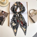 Detail of silk twilly scarf featuring crane patterns and striped edges on books - Chinese Style Crane Floral (LE-177)