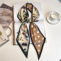 Close-up of floral and polka dot silk neck scarf with fine stitching on white desk - Butterfly Floral Polka Dot (LE-184)