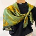 Green silk-like floral scarf 90cm square with yellow peonies styled on black sweater - Bean Green Peony Floral (FM184-2)