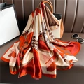 Luxurious plaid color-block scarf elegantly draped over a leather bag in warm tones - Orange Brown Geometric Houndstooth (XL90-1)