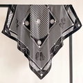 Macro detail of houndstooth silk scarf showing elegant fringe and smooth satin texture - Black and White (FT246-4)