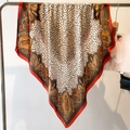 Detailed view of leopard print silk scarf with paisley patterns on metal hanger - Red (FM181-3)
