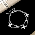 Detailed close-up of double-layer silver bracelet with five zircon clover charms - Silver