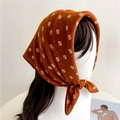 Detail of caramel silk scarf with white leaf pattern worn as a vintage style headscarf - Caramel (FR24-2)