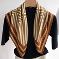 Close-up of geometric striped scarf with mustard yellow and brown tones on black knitwear - 68cmx68cm / Earth Tone Style (FR29-6)