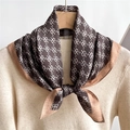 Elegant double-sided square scarf with logo pattern tied as a bow on a white sweater - Coffee Monogram Texture (FR23-1 Coffee)