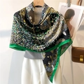 Detail of printed silk scarf with floral daisy pattern and bright green edges - Black Daisy Green Border (FE114-2)