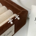 Macro detail of elegant silver pearl earrings with micro-set diamonds on velvet box - 4mm / Silver