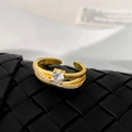 Detail of gold double-layer open ring with micro-pave cubic zirconia and vertical texture - Gold