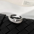 Macro view of silver double-layered open ring featuring micro-inset zircon stones - Silver