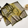 Eiffel Tower print silk scarf displayed with a tea cup and stylish handbag accessories - Ginger Yellow Tower (FE128-1)