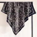 Close-up of black and white paisley silk scarf draped on a minimalist metal hanger - Classic Black White Floral (FT248-2)