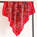 Close-up of red paisley pattern silk scarf showing drape and glossy satin texture - Saturated Pure Red (FT248-3)