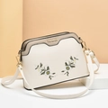 Chic shell-shaped crossbody bag in white and grey with elegant floral embroidery - Off White