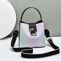 Fashion gradient bucket bag with wide strap and gold hardware in a minimalist studio setting - Black