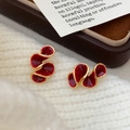 Elegant gold earrings with deep red enamel spiral design on white knitted background - Large Spiral Wave Streamline Style (A-1043)
