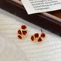 French vintage style gold wavy stud earrings with red enamel on a textured fabric - Small Ancora Red Enamel Stud Earrings