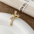 Elegante ear cuff a fiocco dorato con zirconi incastonati su bordo ceramico - Ear Cuff Fiocco Dorato (A-1836)